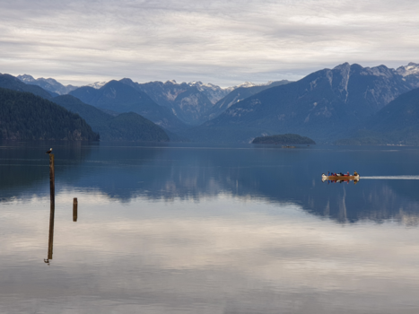 Vancouver - Pitt River Vancouver. Bald eagle and Canadian kanoe